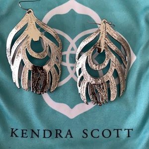 Kendra Scott feather earrings.